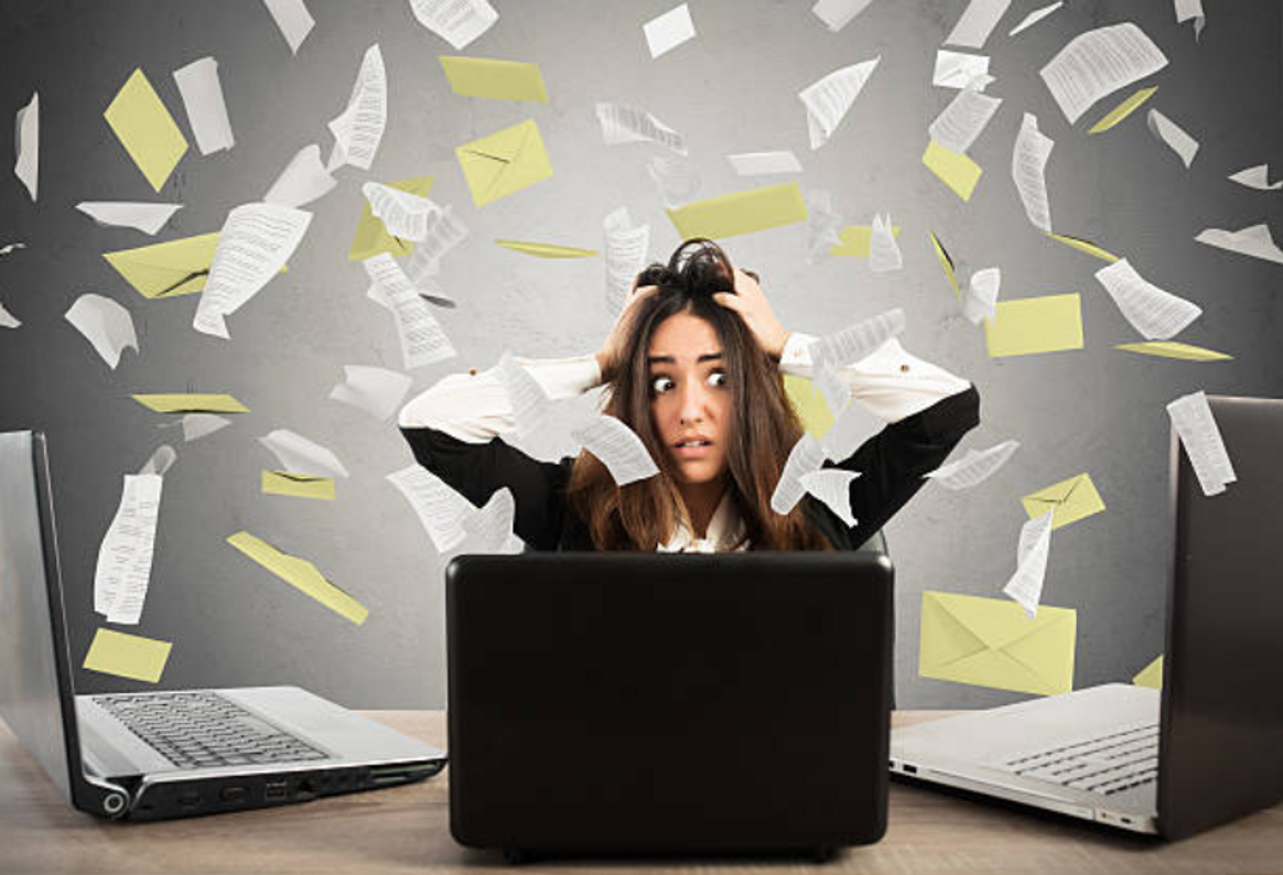 A frustated employee sitting on her desk